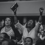 grayscale photography of people worshiping
