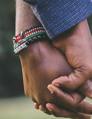 close up photo of two person s holding hands